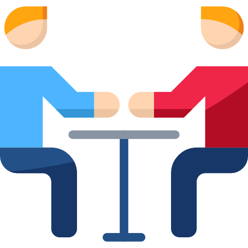 Two people sitting at a table.