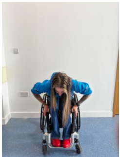 Patient bending in chair